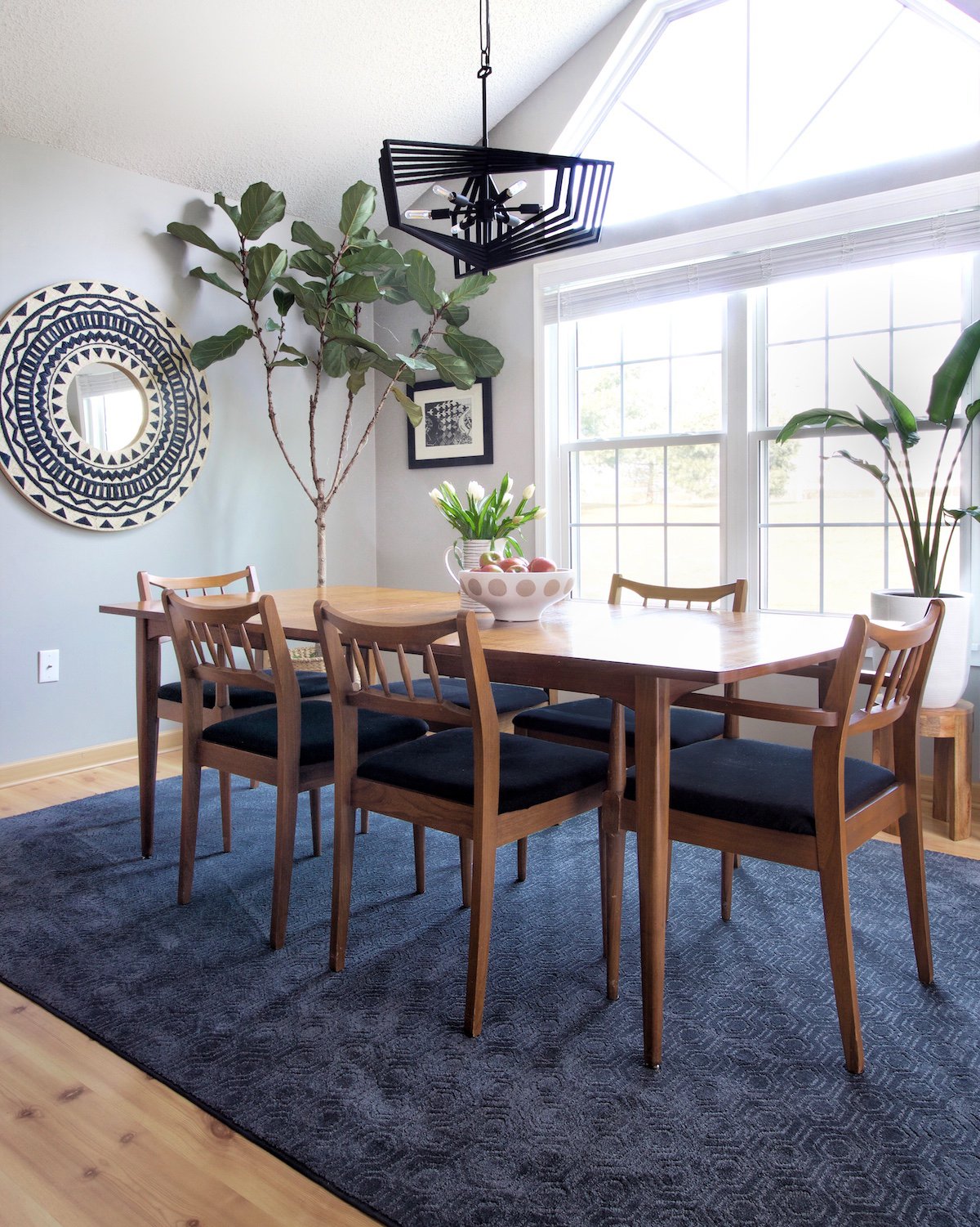 Blue rug under modern dining room table